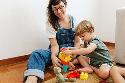 Child playing colorful blocks game with mother – Jacob Lund Photography  Store- premium stock photo
