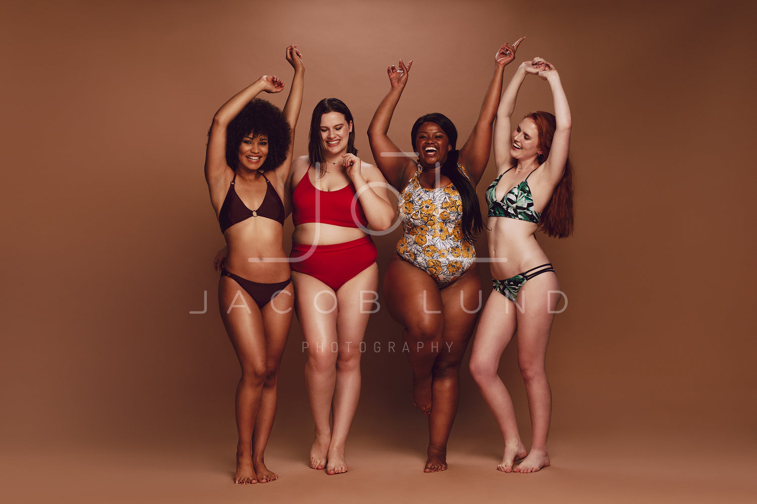 Group Of Happy Women In Underwear Showing Their Fat Belly Stock