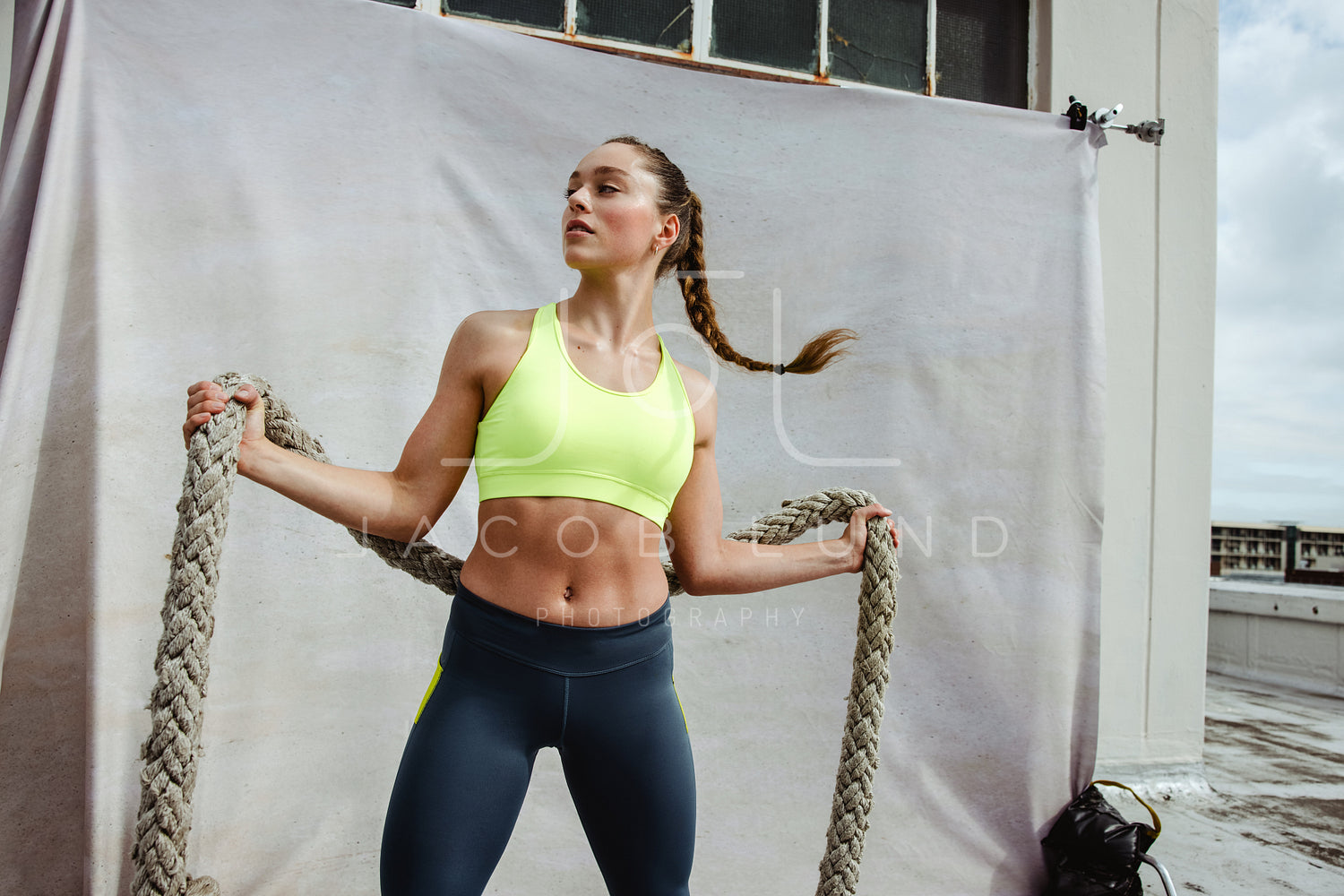 Fitness woman exercising with battle rope – Jacob Lund Photography Store-  premium stock photo
