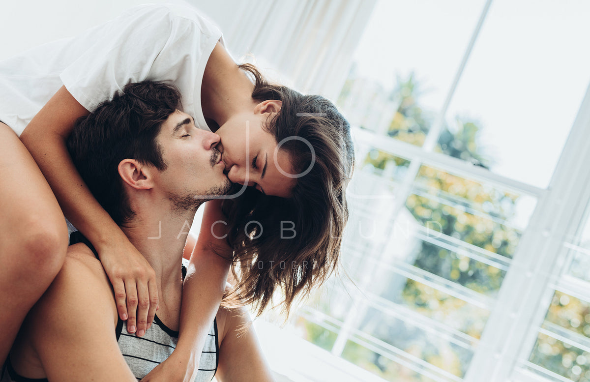 Couple sharing a passionate kiss – Jacob Lund Photography Store- premium  stock photo