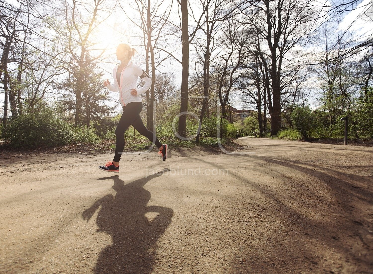 Woman Jogging In Public Park by Microgen Images/science Photo Library