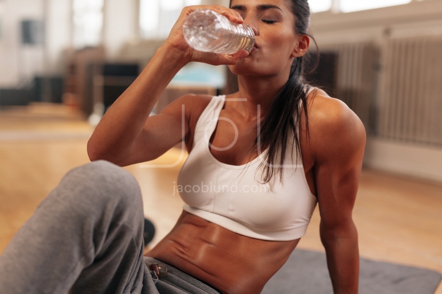 https://jacoblund.com/cdn/shop/products/photo-id-1984459866181-fitness-woman-drinking-water-from-bottle-at-gym.jpg?v=1563841751