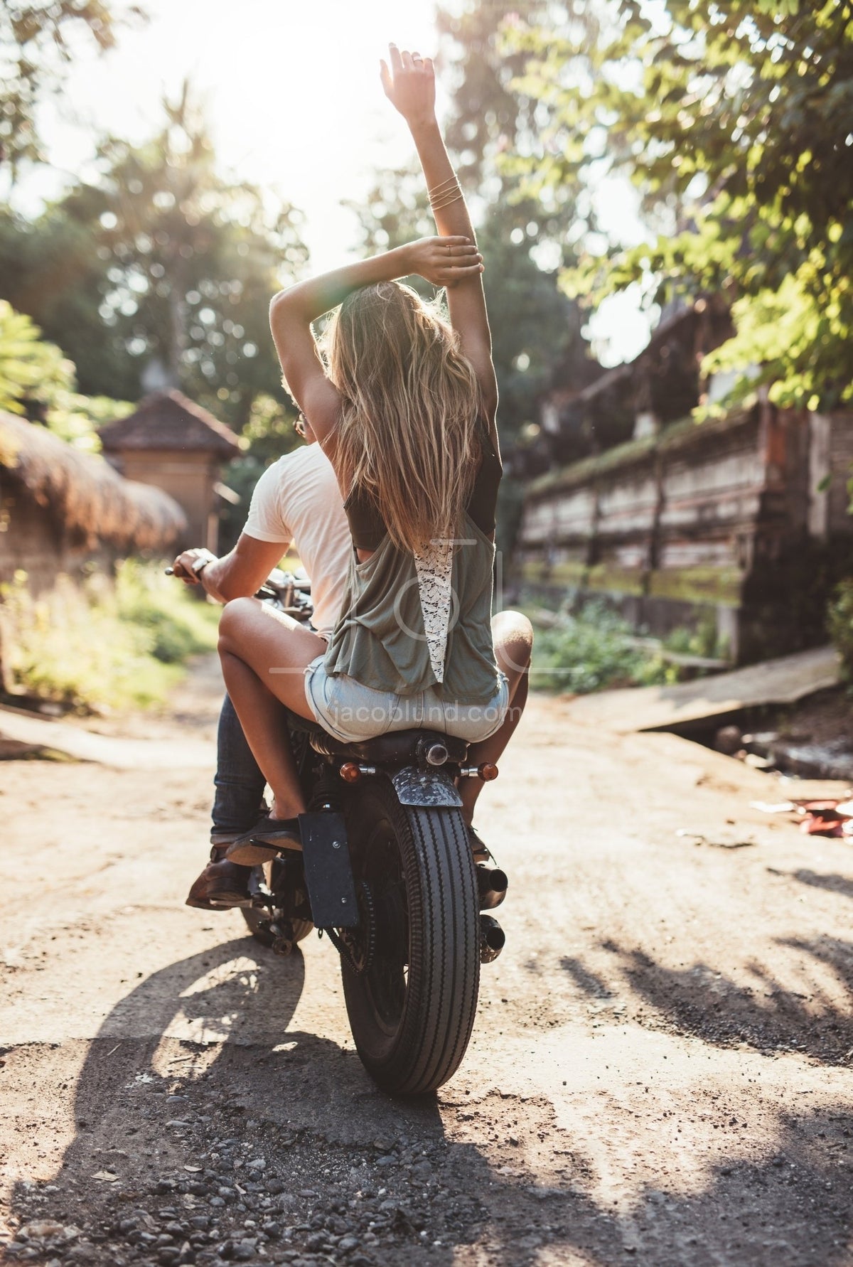 Girl riding on back of outlet motorcycle