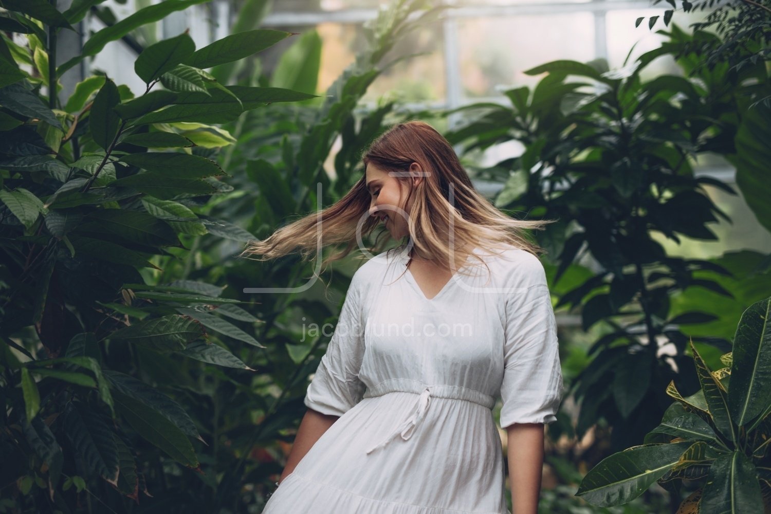 Beautiful female fashion model in greenhouse – Jacob Lund