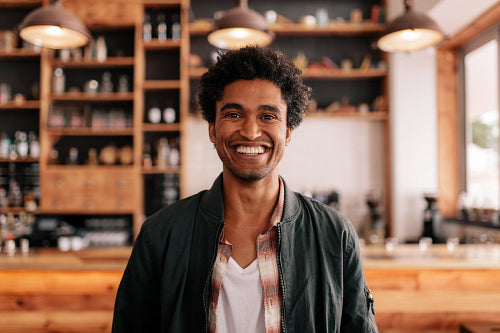 Smiling barista making espresso with a coffee maker – Jacob Lund  Photography Store- premium stock photo