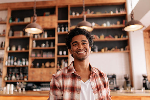 Smiling barista making espresso with a coffee maker – Jacob Lund  Photography Store- premium stock photo