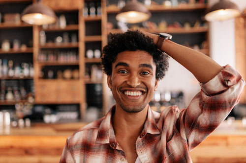 Smiling barista making espresso with a coffee maker – Jacob Lund  Photography Store- premium stock photo