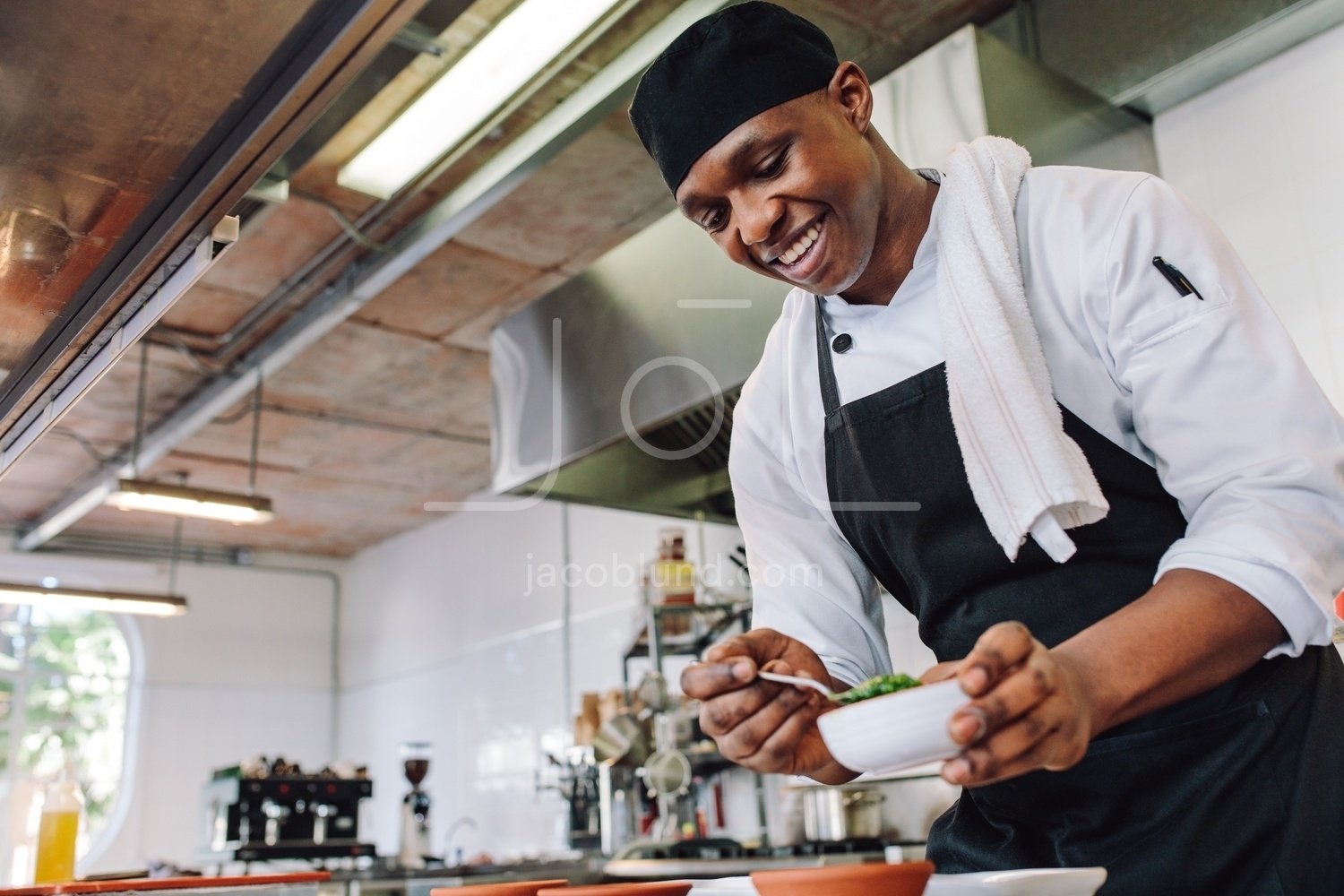 Gourmet chef cooking in a commercial kitchen – Jacob Lund Photography  Store- premium stock photo