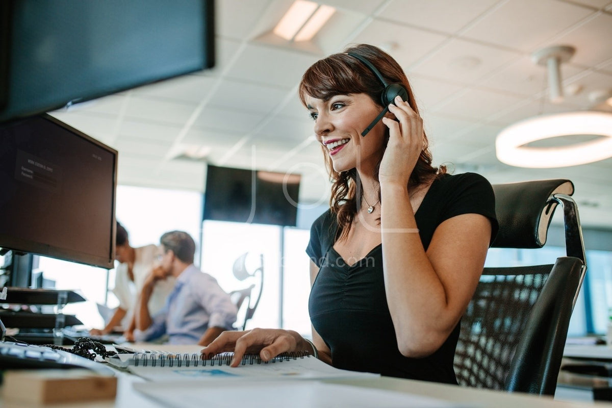 Beautiful mature business woman talking on headset – Jacob Lund Photography  Store- premium stock photo