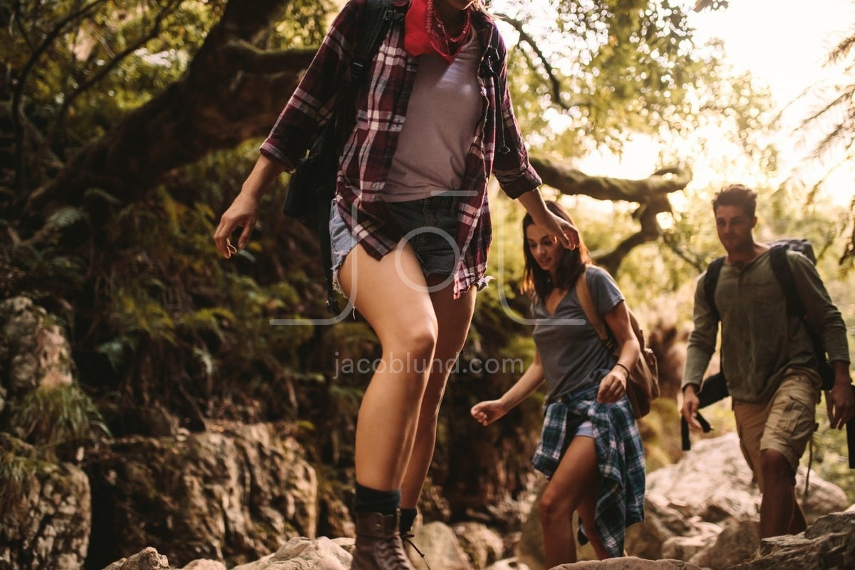 Woman hiking through mountain trail on a sunny day – Jacob Lund Photography  Store- premium stock photo