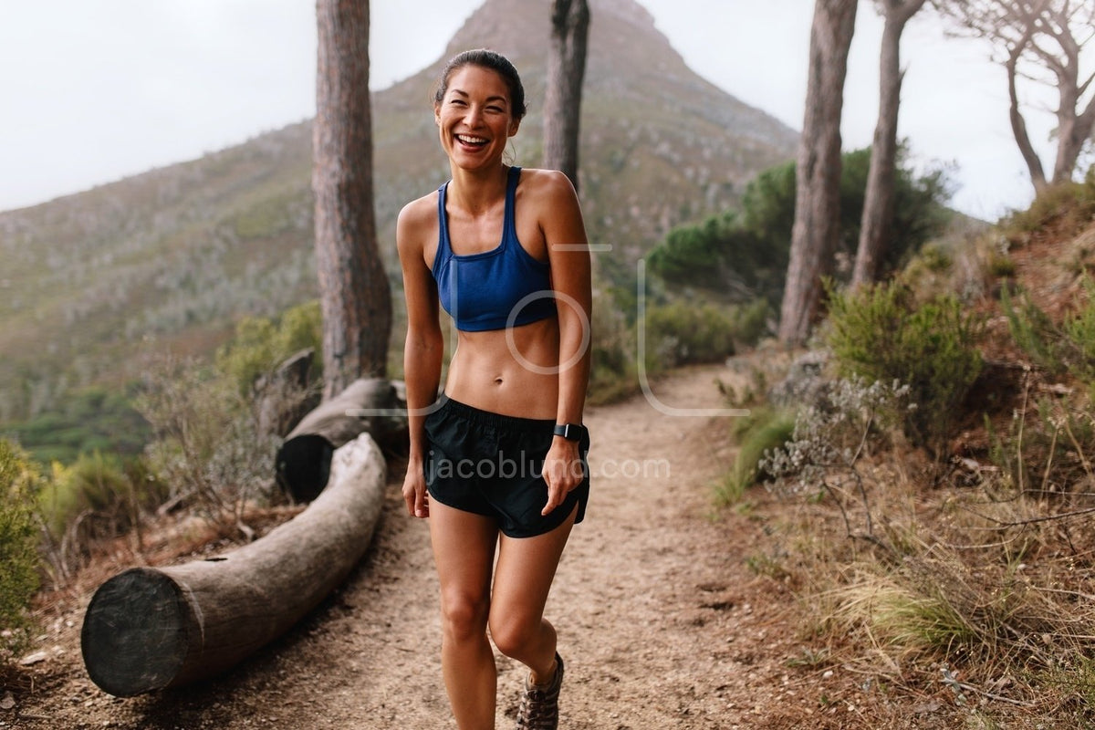 Asian Female Hiker On Hiking Trail by Stocksy Contributor Jacob