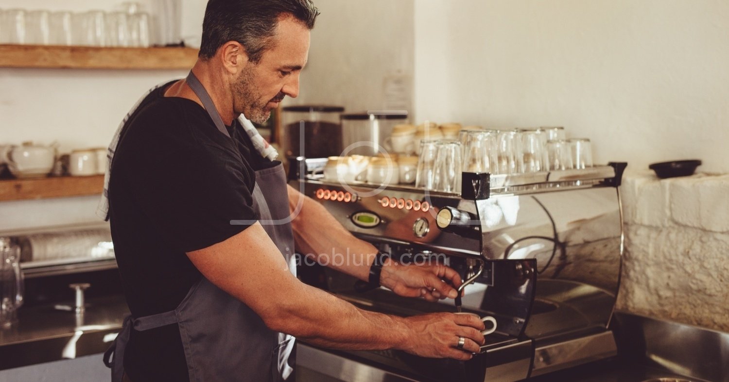 https://jacoblund.com/cdn/shop/products/photo-id-4350114824261-barista-making-coffee-with-a-machine.jpg?v=1580124228