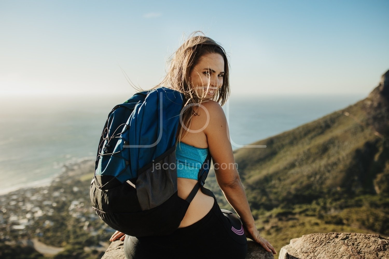 Two happy women sitting on the promenade with beach workout essentials –  Jacob Lund Photography Store- premium stock photo