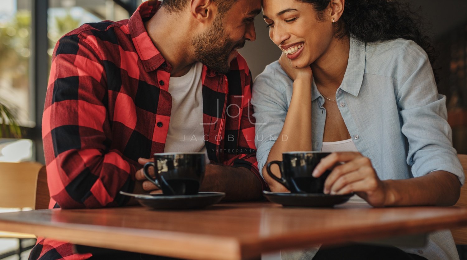 Cute couple having coffee in a luxury hotel room – Jacob Lund Photography  Store- premium stock photo