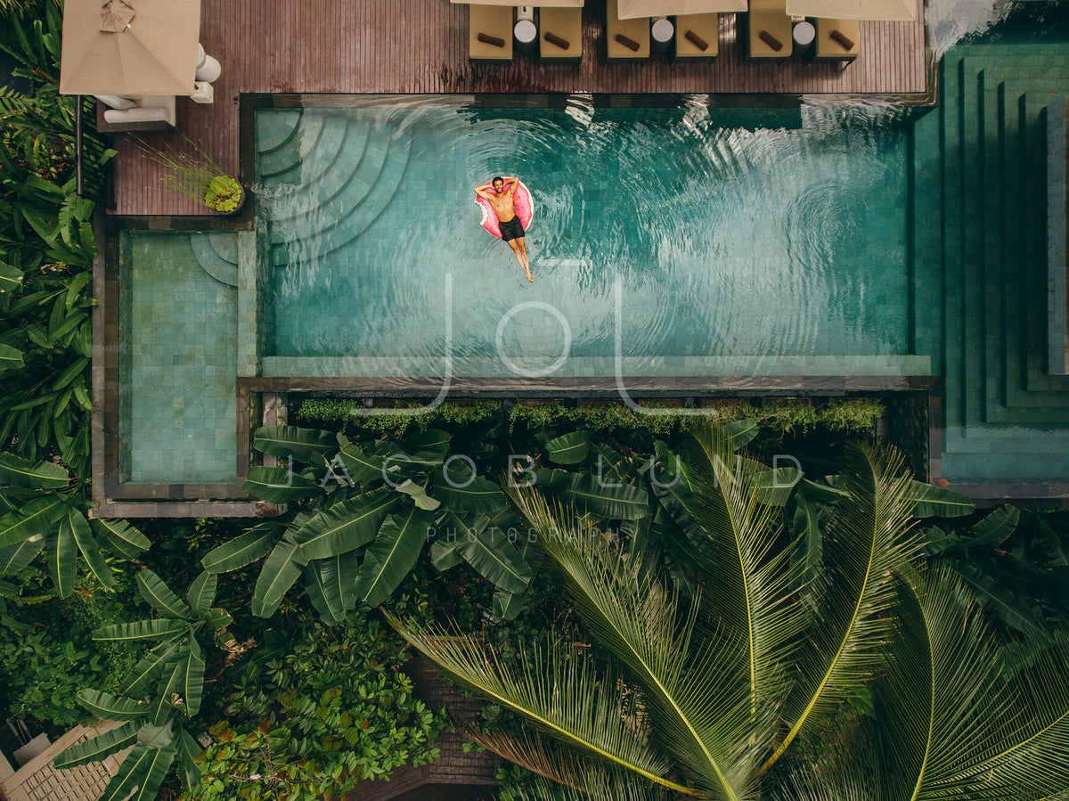 Young Man Relaxing In Resort Swimming Pool – Jacob Lund Photography 